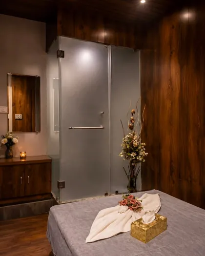 Massage room with attached glass shower